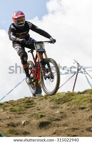 Val Di Sole, Italy - 22 August 2015: Gstaad-Scott Team,  Rider Mulally Neko in action during the mens elite Downhill final World Cup at the Uci Mountain Bike in Val di Sole, Trento, Italy