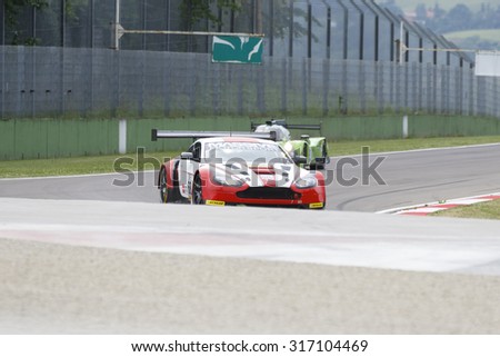 Imola, Italy May 16, 2015: Aston Martin Vantage GT3 of MASSIVE MOTORSPORT Team, driven by Casper Elgaard - Kristian Poulsen -  Simon Moller, in action during the European Le Mans Series - 4 Hours