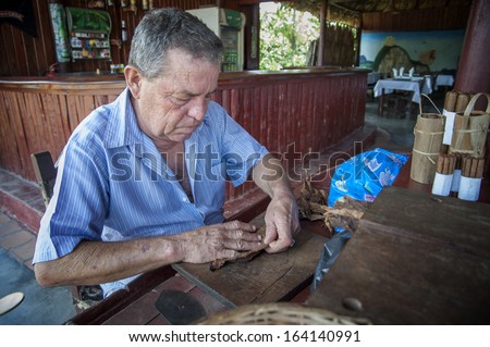 Vinales ( Cuba ) 19-05-2013: a typical tobacco worker that produce the famous cuban cigars. Cigars industry is one of the few industries in the island but it\'s value is known all over the world.