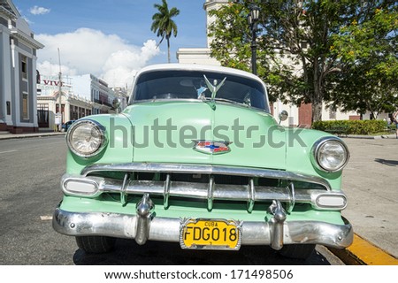 CIENFUEGO, CUBA -  MAY-21-2013:a typical old style American car that tourists can find going to visit Cuba. In other nations these cars are for collectors and it\'s difficult to find them
