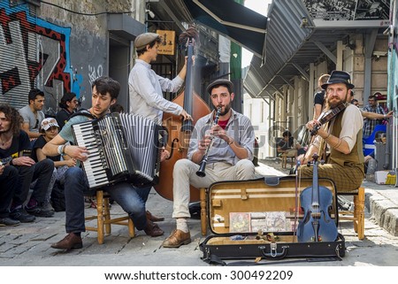 Istanbul, Turkey - 15/06/2014: street musicians are present in a lot of streets of Istanbul and tourists are accompained by theyr music douring the visit of the city