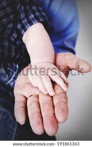 Old and young hand in hand