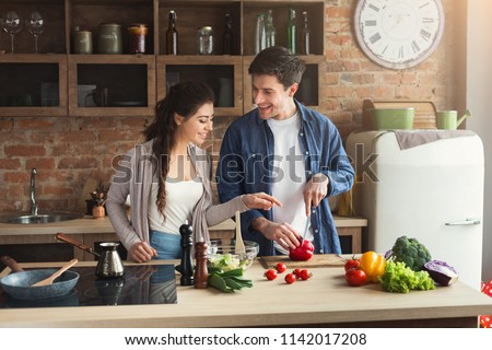 Similar – Image, Stock Photo Couple preparing food in kitchen.