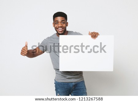 Similar – Image, Stock Photo Cheerful black showing frame gesture on city street