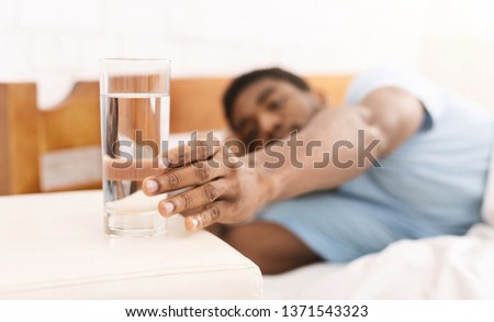 Similar – Image, Stock Photo Content black man reaching hand to camera in studio