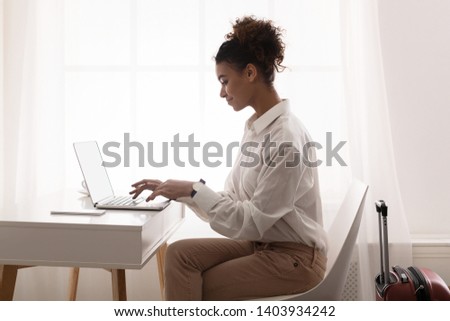 Similar – Image, Stock Photo Black woman sending a message on smartphone near sea in sunset