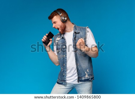 Similar – Image, Stock Photo Bearded man listening to music in headphones