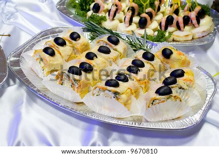 Catering buffet style - flacky pastry rolls with olives