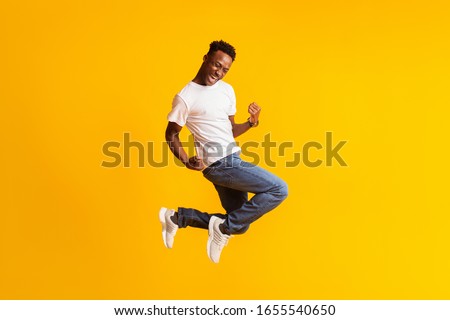 Similar – Image, Stock Photo Young black man enjoying music in headphones