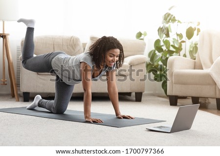 Online Training. Fit Young Woman Excersising At Home, Watching Video Tutorial On Laptop