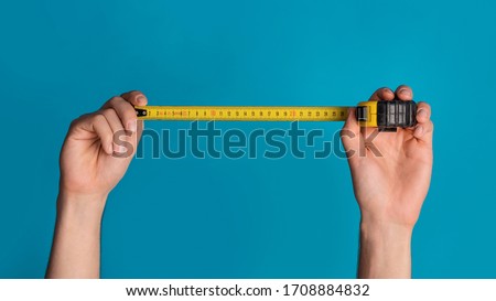 Similar – Image, Stock Photo Renovation concept. Male worker plastering a wall using a long spatula