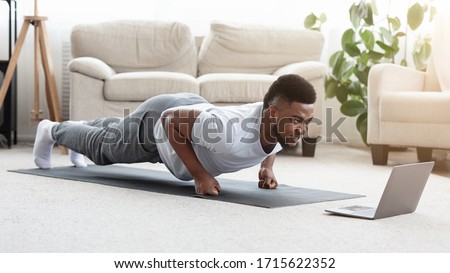 Similar – Image, Stock Photo Male making yoga exercise near window