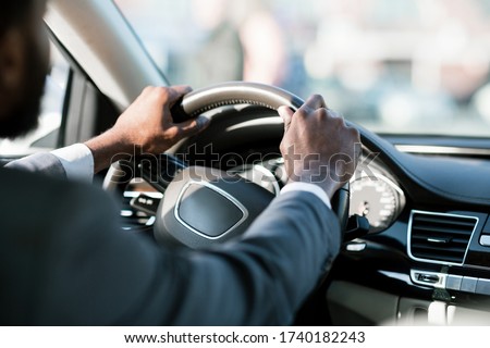 Similar – Image, Stock Photo Unrecognizable man driving car in Ireland