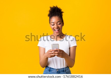 Similar – Image, Stock Photo Afro woman using mobile with an orange wall