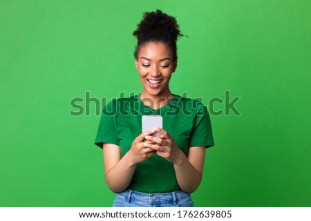 Similar – Image, Stock Photo Afro woman using mobile with an orange wall