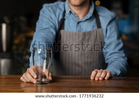 Similar – Foto Bild Crop Barkeeper serviert Getränke in einem Cafe