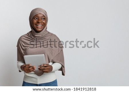 Similar – Foto Bild Muslimische Frau mit Tablet auf der Couch