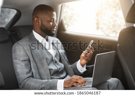 Similar – Image, Stock Photo Concentrated male passenger using laptop in train