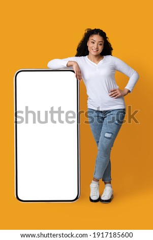 Similar – Image, Stock Photo Cheerful black woman leaning on railing in port