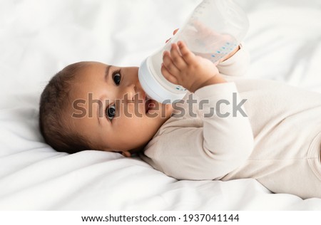 Similar – Image, Stock Photo Toddler drinking milk bottle