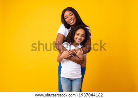 Similar – Image, Stock Photo Mother with cheerful child in the park.