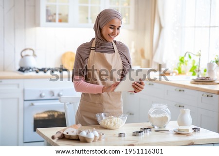 Similar – Foto Bild Muslimische Frau mit Tablet auf der Couch