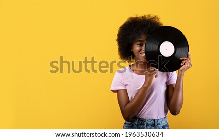 Similar – Image, Stock Photo Woman holding vinyl record. Music passion. Listening to music from analog record. Playing music from analog disk. Enjoying music from old collection. Retro and vintage. Stereo audio. Analog sound
