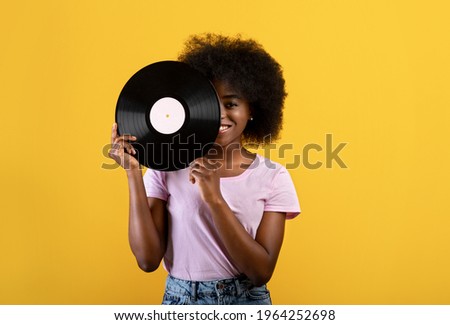 Similar – Image, Stock Photo Woman holding vinyl record. Music passion. Listening to music from analog record. Playing music from analog disk. Enjoying music from old collection. Retro and vintage. Stereo audio. Analog sound