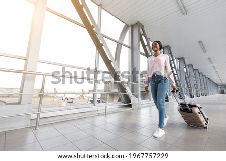 Similar – Image, Stock Photo Traveling woman with suitcase in airport