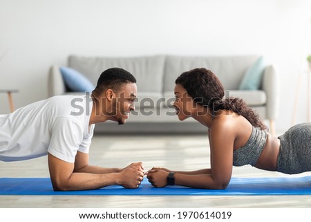 Similar – Image, Stock Photo Young happy couple staying at home with their baby son sitting on the living room floor.