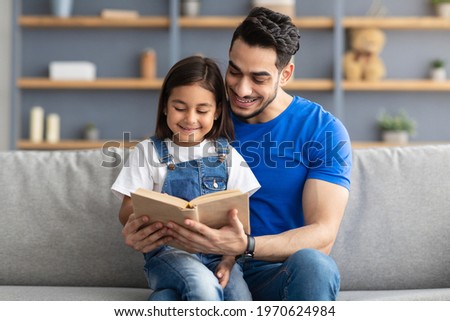 Image, Stock Photo Single father sitting on grass by the tree with little daughter