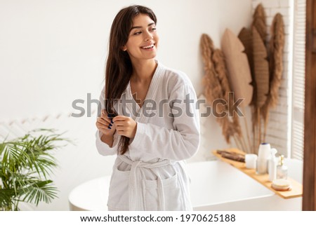 Similar – Image, Stock Photo Young woman in bathtub with balloons after party