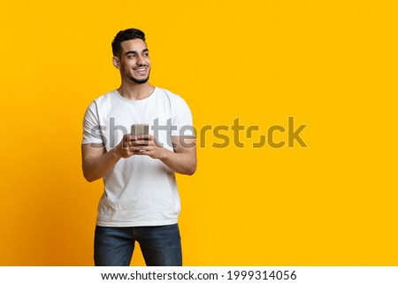 Similar – Image, Stock Photo Stylish attractive guy with dreadlocks is recording a song in the studio. A young singer in black studio headphones stands in front of a microphone in the blurred background. Low key lighting.