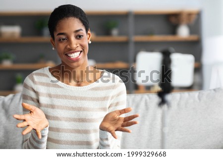 Similar – Image, Stock Photo Black woman recording video for social media