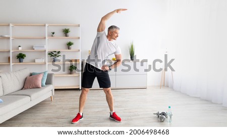 Similar – Image, Stock Photo Flexible man training on aerial straps