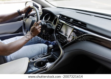 Similar – Image, Stock Photo Unrecognizable man driving car in Ireland