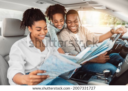 Similar – Image, Stock Photo Focused woman with map sitting near camping tent in nature