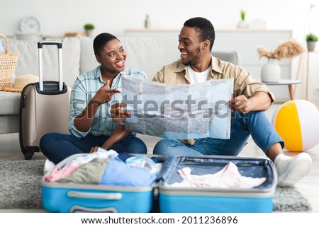 Similar – Image, Stock Photo Focused woman with map sitting near camping tent in nature