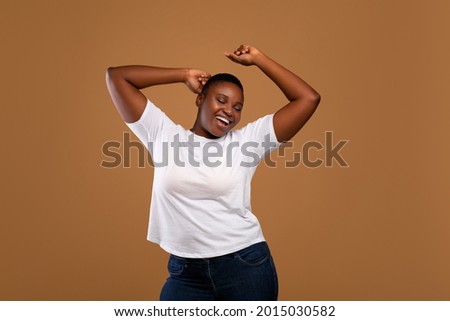 Similar – Image, Stock Photo Cheerful black woman in bright outfit