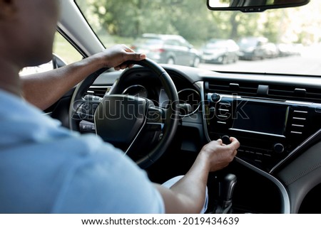 Similar – Image, Stock Photo Unrecognizable man driving car in Ireland