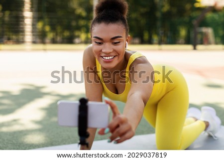 Similar – Image, Stock Photo Black woman recording video for social media