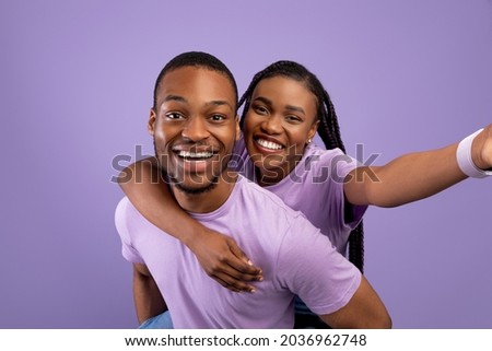 Similar – Image, Stock Photo Cheerful black friends taking selfie in city