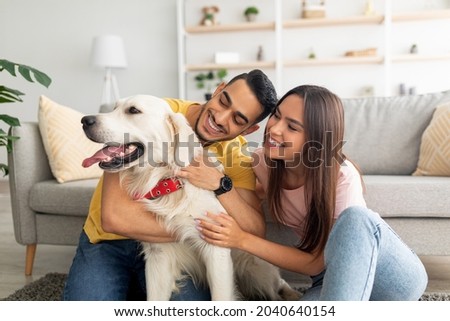 Similar – Image, Stock Photo Cheerful woman with dog in pet cone at home