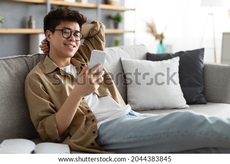 Similar – Image, Stock Photo Focused man using smartphone on rooftop