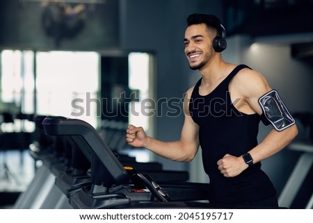 Similar – Image, Stock Photo Athletic man listening to music.