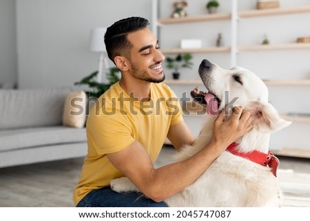 Similar – Image, Stock Photo Man playing with dog on beach