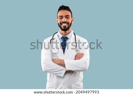 Similar – Image, Stock Photo Arabian man in blue clothes walking on a desert dune.