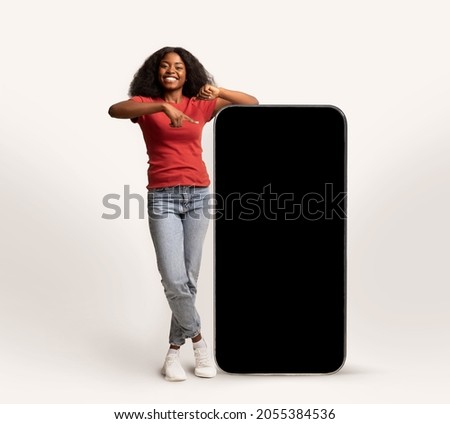 Similar – Image, Stock Photo Cheerful black woman leaning on railing in port