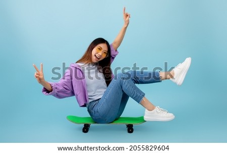 Similar – Image, Stock Photo Cute girl sitting on the stairs outside the campus after college class and chatting with her friends