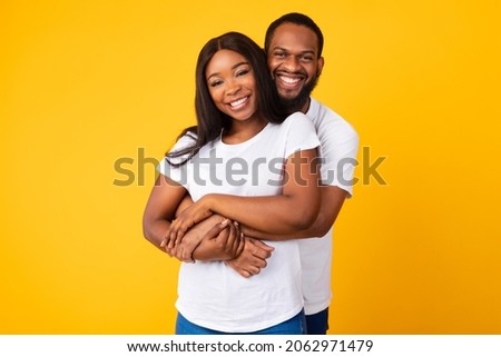 Similar – Image, Stock Photo Beautiful couple enjoying with their baby son in a swing, on the green grass of the garden at the countryside